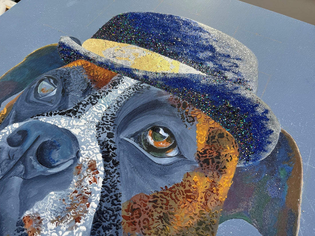 close up of artwork Al Capone showing stenciled texture, glitter and  gold leaf.